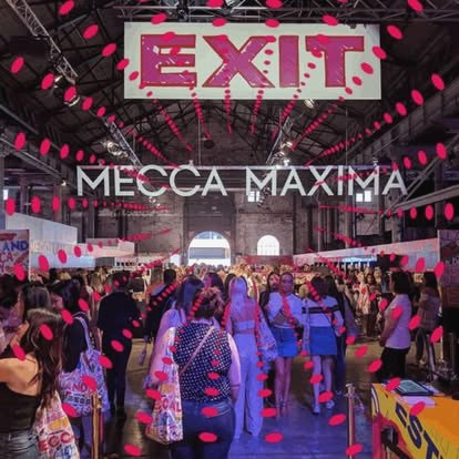The Mecca Maxima hall at Meccaland, crowds beneath a neon EXIT sign and pink floating dots